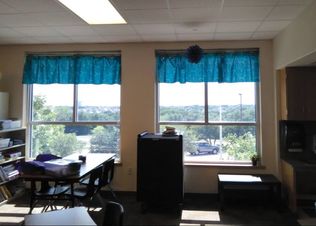 Wide shot of two windows with curtains